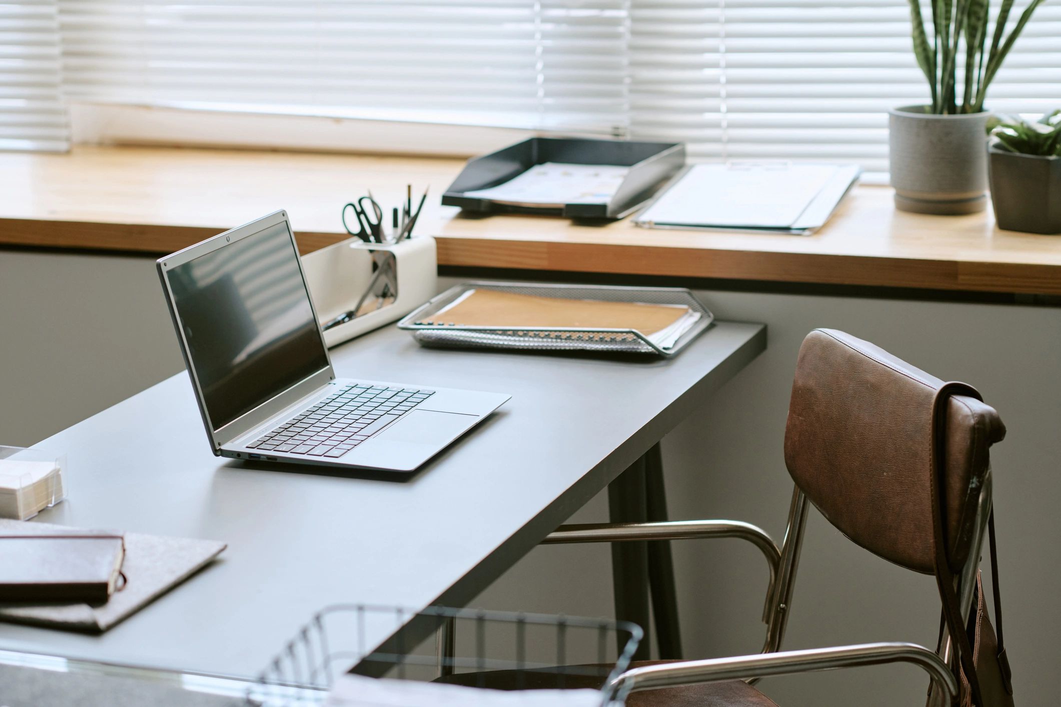 Financial planning workspace with laptop and documents